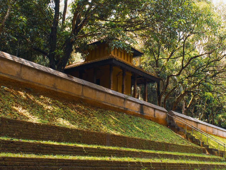 An open tropical pavilion set among dense green planting in Sri Lanka